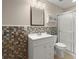 Bathroom with colorful tile accent wall, a large mirror, and a glass-enclosed shower at 212 Ranier Court, Canton, GA 30114