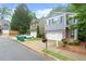 Attractive two-story house with manicured landscaping, a paved driveway, and an attached garage at 212 Ranier Court, Canton, GA 30114