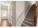 Entryway with a staircase, hardwood floors, neutral walls, and white trim and doors at 212 Ranier Court, Canton, GA 30114