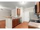 Functional kitchen with wood cabinets, stainless steel appliances, and a breakfast bar at 212 Ranier Court, Canton, GA 30114