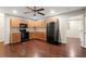 Spacious kitchen with stainless steel appliances and wood cabinets at 212 Ranier Court, Canton, GA 30114