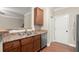 Kitchen boasts wooden cabinets, stainless steel sink, and a dishwasher at 212 Ranier Court, Canton, GA 30114