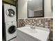 Bathroom includes a stackable washer and dryer at 212 Ranier Court, Canton, GA 30114