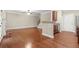 Open-concept layout flows from living room to kitchen with hardwood flooring at 212 Ranier Court, Canton, GA 30114