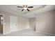 Spacious main bedroom with tray ceiling, fan, and neutral decor at 212 Ranier Court, Canton, GA 30114