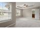 Bedroom with a tray ceiling, ceiling fan and large window for natural light at 212 Ranier Court, Canton, GA 30114