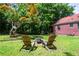 Beautiful backyard featuring a fire pit, lawn chairs, and mature trees perfect for outdoor relaxation and entertaining at 3020 Washington Rd, East Point, GA 30344