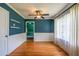 Charming dining area with hardwood floors, white trim, and ample natural light at 3020 Washington Rd, East Point, GA 30344