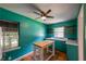 Charming kitchen boasts stainless fixtures, custom wood shelving, vintage fridge, and butcher block island at 3020 Washington Rd, East Point, GA 30344