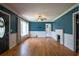 Spacious living room with hardwood floors, fireplace, and large windows for natural light at 3020 Washington Rd, East Point, GA 30344