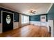 Lovely living room boasting hardwood floors, a white-washed brick fireplace, and natural lighting at 3020 Washington Rd, East Point, GA 30344