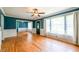 Bright living room with large windows, hardwood floors, and a view to the front yard at 3020 Washington Rd, East Point, GA 30344