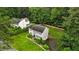 Charming two-story home with classic shutters, mature landscaping, and a lush, green lawn nestled among mature trees at 3262 Mitsy Forest Way, Marietta, GA 30068