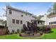 Large backyard featuring a patio, lush greenery, and charming exterior details at 3262 Mitsy Forest Way, Marietta, GA 30068