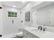 Bright bathroom with a glass shower, white tile, and marble countertop at 3262 Mitsy Forest Way, Marietta, GA 30068