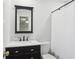 Charming bathroom featuring black vanity, marble countertop, and elegant fixtures at 3262 Mitsy Forest Way, Marietta, GA 30068