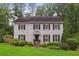 Charming two-story home with a manicured lawn, complemented by lush greenery and a welcoming facade at 3262 Mitsy Forest Way, Marietta, GA 30068