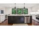 Modern kitchen with a large central island, black accents, and stainless steel appliances at 3262 Mitsy Forest Way, Marietta, GA 30068