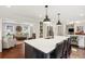 Bright, open kitchen with island seating flows into living room, perfect for entertaining and Gathering time at 3262 Mitsy Forest Way, Marietta, GA 30068