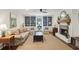 Inviting living room featuring built-in bookcases, a fireplace, and neutral decor at 3262 Mitsy Forest Way, Marietta, GA 30068