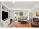 Bright living room with hardwood floors, built-in shelves, and a comfortable seating arrangement at 3262 Mitsy Forest Way, Marietta, GA 30068