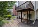 View of the backyard, deck, and the home's exterior showcasing outdoor living at 5159 Wellsley Bnd, Alpharetta, GA 30005