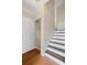 Entryway featuring wood floors, white trim, and a staircase at 5159 Wellsley Bnd, Alpharetta, GA 30005