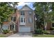 Beautiful brick townhome with attached garage and manicured landscaping at 5159 Wellsley Bnd, Alpharetta, GA 30005