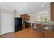 Well-equipped kitchen featuring stainless steel appliances and sleek dark cabinetry at 5159 Wellsley Bnd, Alpharetta, GA 30005