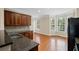 Charming kitchen featuring dark wood cabinets, granite countertops, and a bright breakfast nook at 5159 Wellsley Bnd, Alpharetta, GA 30005
