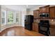 Bright kitchen area with stainless steel appliances and a sunlit breakfast nook at 5159 Wellsley Bnd, Alpharetta, GA 30005