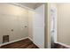 Laundry room featuring white trim, hookups, and a view to the hall at 5159 Wellsley Bnd, Alpharetta, GA 30005