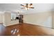 Open floor plan featuring hardwood floors and a view of the kitchen area at 5159 Wellsley Bnd, Alpharetta, GA 30005