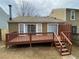 Spacious wood back deck with staircase down to the yard and sliding glass doors to access home at 6448 Charter Way, Lithonia, GA 30058