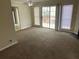 Open living room area with sliding glass doors leading to the back deck at 6448 Charter Way, Lithonia, GA 30058