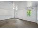 Large unfinished basement area with ample space and natural lighting at 7920 Silversmith Dr, Cumming, GA 30028