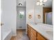 Bathroom with double sink vanity, tile flooring, and updated fixtures at 7920 Silversmith Dr, Cumming, GA 30028