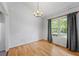 Bright dining room with hardwood floors and a chandelier at 7920 Silversmith Dr, Cumming, GA 30028