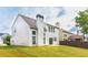 A shot of the exterior of a home featuring a beautiful lawn and chimney at 8750 Radford Ln, Suwanee, GA 30024