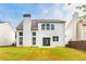 A shot of the exterior of a home featuring a beautiful lawn and chimney at 8750 Radford Ln, Suwanee, GA 30024