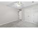 Bedroom featuring neutral paint, new carpet, and double door closet at 8750 Radford Ln, Suwanee, GA 30024