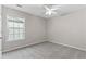Bedroom featuring neutral paint, new carpet, and natural light at 8750 Radford Ln, Suwanee, GA 30024