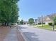 A shot of the neighborhood featuring a quiet street and beautiful trees at 8750 Radford Ln, Suwanee, GA 30024