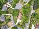 Aerial view of a neighborhood in a wooded setting with homes surrounding a cul-de-sac at 125 Savannah Estates Dr, Atlanta, GA 30350