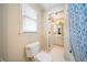Bright bathroom with toilet and window at 125 Savannah Estates Dr, Atlanta, GA 30350
