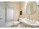 Bathroom featuring a pedestal sink and tiled shower at 125 Savannah Estates Dr, Atlanta, GA 30350