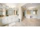 Spacious bathroom with double sinks, ample storage, and multiple mirrors to create a sense of openness at 125 Savannah Estates Dr, Atlanta, GA 30350