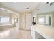 Bright bathroom with marble floors and plenty of storage space and natural light at 125 Savannah Estates Dr, Atlanta, GA 30350