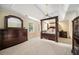 Bedroom with carpet and dark wood furniture provides an inviting space with ample closet space at 125 Savannah Estates Dr, Atlanta, GA 30350