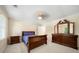 Spacious bedroom featuring ample natural light, neutral walls, carpet and wood furniture at 125 Savannah Estates Dr, Atlanta, GA 30350